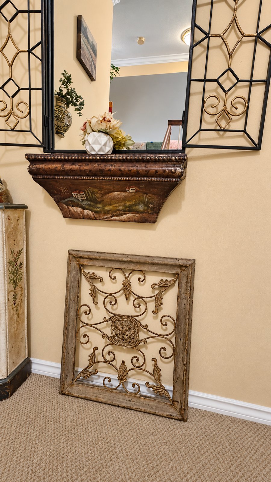 Mirror shelf and scrollwork detail