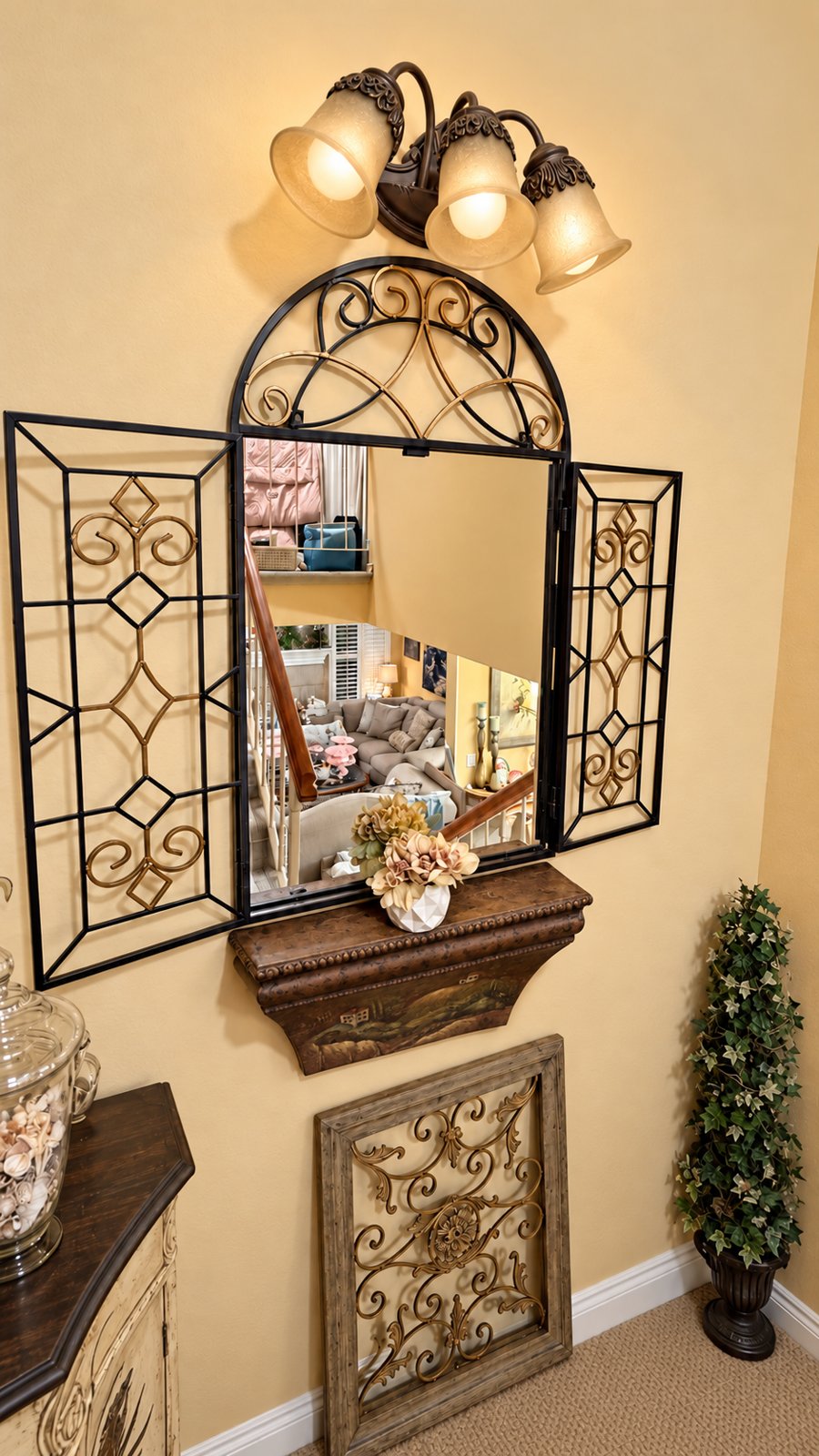 Arched mirror and sconce